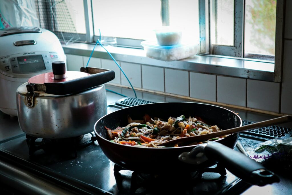 black cooking pan with food, Creative Ways to Repurpose Leftovers Into New Meals