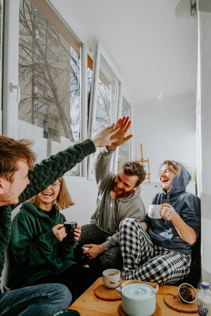 woman in black and white checkered long sleeve shirt sitting beside man in green crew neck, Big Family Life Tips