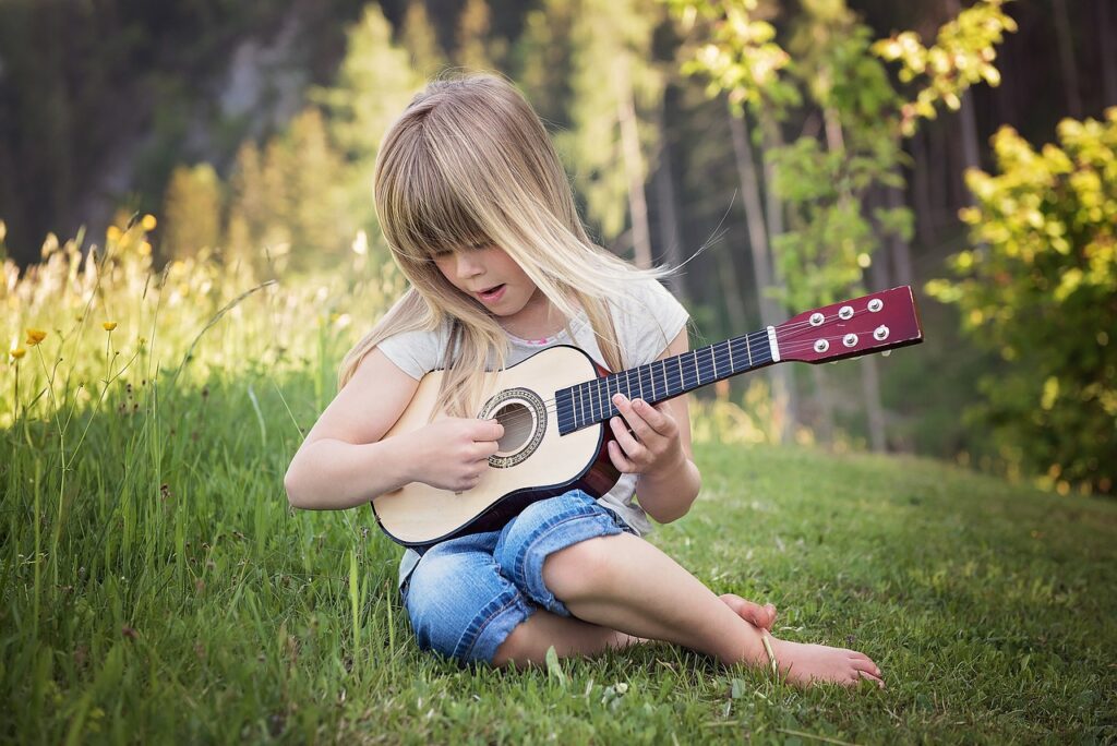 person, human, child, girl, blond, guitar, make music, play guitar, music, outdoors, nature, portrait, human, guitar, guitar, music, music, music, music, music. After years of living with earworms β both my own and those transmitted by six musically-diverse children β I've learned that fighting them is usually futile.