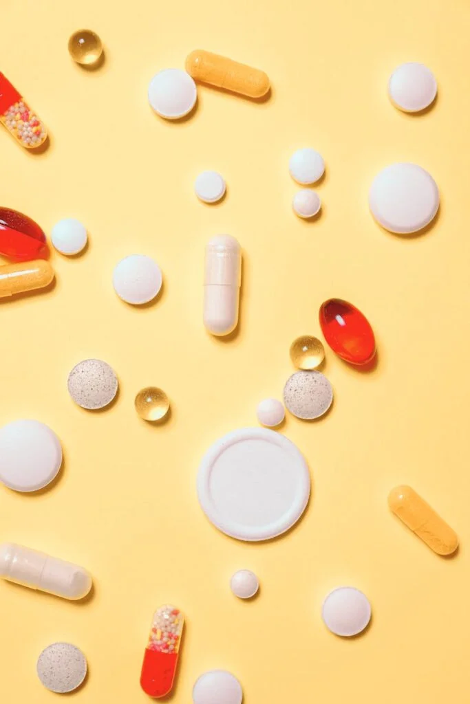 Life-Changing Supplement Stack for Healing Doctors Missed β bottles of TUDCA, NAC, Berberine, Magnesium Glycinate, CoQ10, Vitamin D3/K2, Probiotics, and Omega-3 arranged on a neutral background